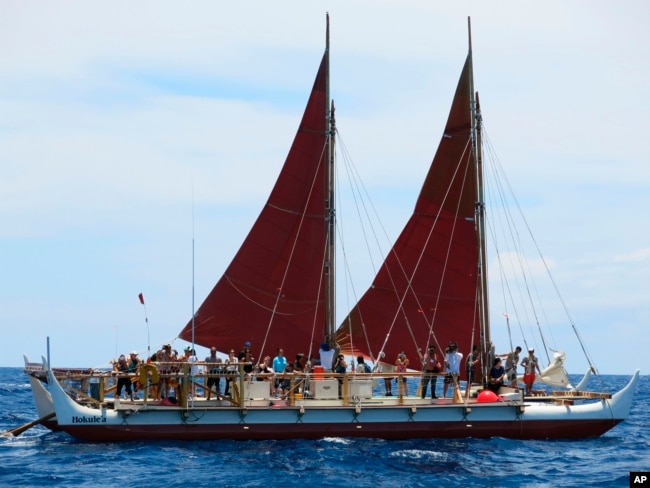 FILE - The Hokulea sailing canoe is seen off Honolulu, April 29, 2014. The Polynesian voyaging canoe is returning to Hawaii after a three-year journey around the world guided only by nature with navigators using no modern navigation across 40,000 nautical miles.
