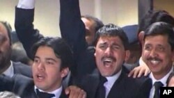 Pakistani lawyers celebrate Supreme Court decision to reopen corruption cases against President Asif Ali Zardari and some of his cabinet members