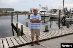 Mikey Daniels poses in Wanchese, North Carolina, May 31, 2017.