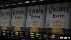 The logo of Corona beer, produced by a Group Modelo brewery in Mexico, is seen on a truck carrying bottles of beer in Mexico City, Jan. 27, 2017