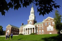 FILE - Colby College students walk to class Wednesday, Sept. 24, 2003, in Waterville, Maine. (AP Photo/Robert F. Bukaty)