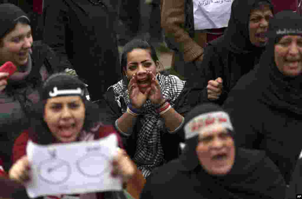 Egyptian protesters chant slogans as they attend a demonstration in Tahrir square in Cairo, Egypt, Dec. 14, 2012. 