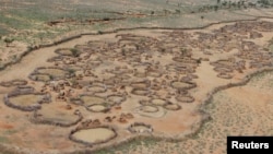 FILE - An aerial view shows an arid, deserted traditional Turkana village in the northwestern Samburu district of northern Kenya, November 2012.