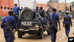 Congolese police move to quell protests in the eastern Congolese town of Beni, Dec. 28, 2018.