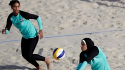 Egypt's Doaa Elghobashy, right, wears longer clothing and a hijab. This photo is from the 2016 Olympics in Brazil. (AP Photo/Marcio Jose Sanchez, File)