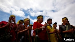 FILE - Members from the Taiwan Pingpu tribe protest during International Day of the World's Indigenous People near the presidential office in Taipei.