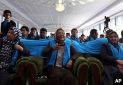 FILE - Habiba Sarabi, then an Afghan vice presidential candidate, attends a campaign rally in Kabul, March 17, 2014. 