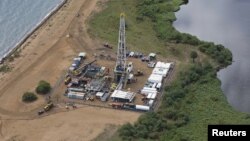 FILE - An aerial view of an oil exploration site in Bulisa district, approximately 244 km (152 miles) northwest of Kampala in this undated handout photo from Tullow Oil Uganda, received by Reuters July 4, 2012. 