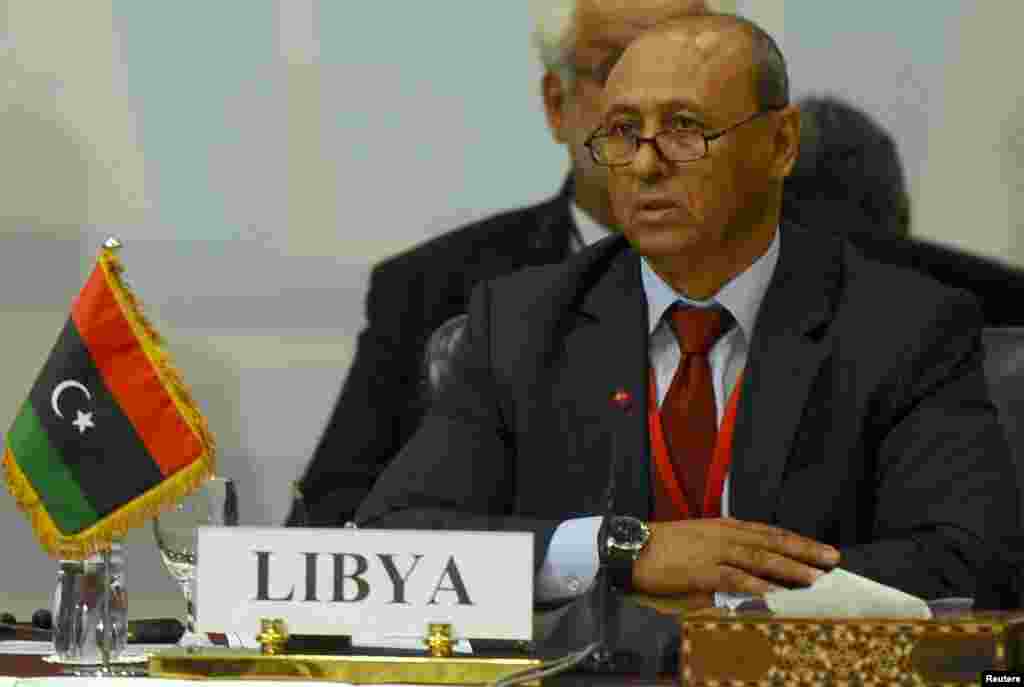 Libyan Foreign Minister Mohammed Abdel Aziz attends the Fourth Ministerial Meeting for the Neighboring Countries of Libya, which aims to address the latest developments in the security and political situation in Libya, in Cairo, Aug. 25, 2014.