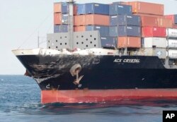 In this photo released by Japan's 3rd Regional Coast Guard Headquarters, the damage of Philippine-registered container ship ACX Crystal is seen in the waters off Izu Peninsula, southwest of Tokyo, after it had collided with the USS Fitzgerald, June 17, 2017.