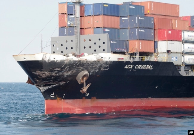 In this photo released by Japan's 3rd Regional Coast Guard Headquarters, the damage of Philippine-registered container ship ACX Crystal is seen in the waters off Izu Peninsula, southwest of Tokyo, after it had collided with the USS Fitzgerald, June 17, 20