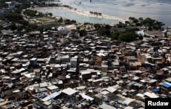 An artificial pond known as piscinao, or big pool, is seen next to the Mare slums complex, in the northern suburbs of Rio de Janeiro, Brazil, Jan. 15, 2017.