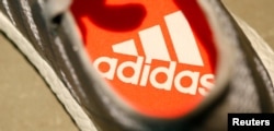 FILE - An Adidas logo is pictured inside a shoe before the company annual general meeting in Fuerth near Nuremberg, Germany, May 11, 2017.
