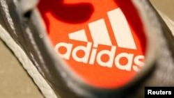 An Adidas logo is pictured inside a shoe before the company annual general meeting in Fuerth near Nuremberg, Germany, May 11, 2017.