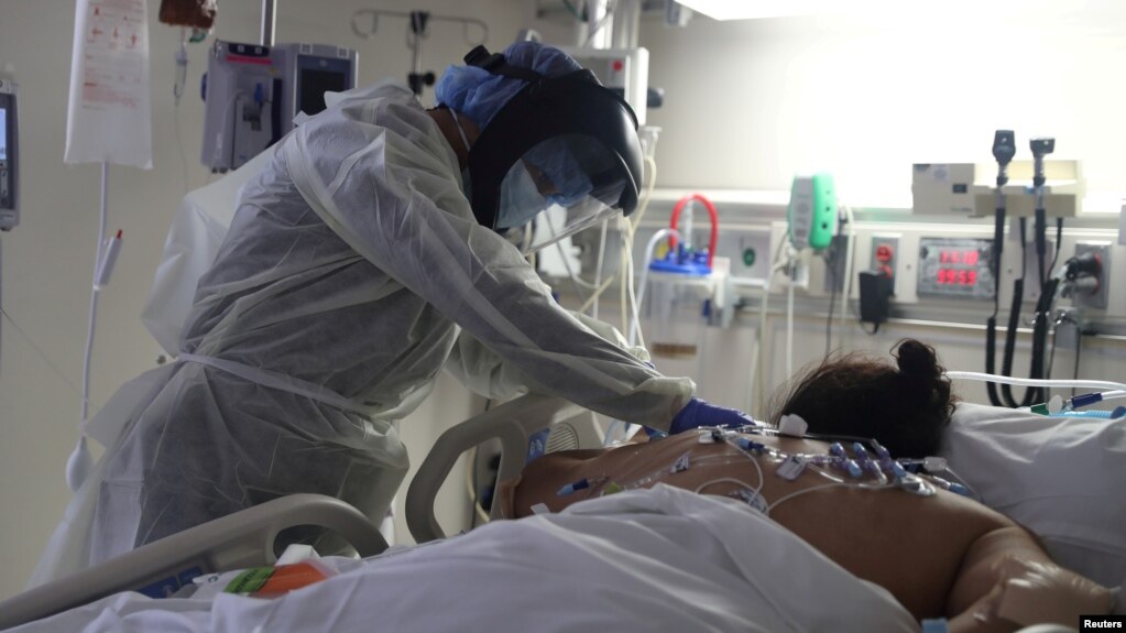 FILE - A medical staff member treats a patient suffering from the coronavirus disease (COVID-19) in the Intensive Care Unit (ICU), at Scripps Mercy Hospital in Chula Vista, California, U.S., May 12, 2020. (REUTERS/Lucy Nicholson/File Photo)