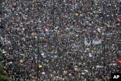 Protesters gather on Victoria Park in Hong Kong on Sunday, Aug. 18, 2019.