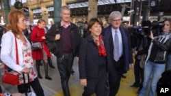 Candidate for the French Socialist Party presidential election Martine Aubry, center, arrives in Paris during the second round of the party's primary election to chose a candidate for the 2012 French presidential elections in Paris, October, 16, 2011.