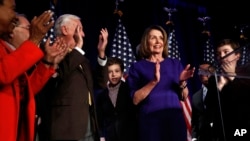 House Democratic Leader Nancy Pelosi of Califorina, right, claps after speaking about Democratic wins in the House of Representatives, on Nov. 6 in Washington, D.C. (AP Photo/Jacquelyn Martin)