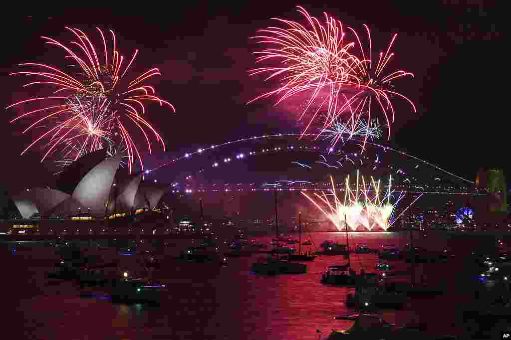 Fireworks explode over the Sydney Opera House and Harbour Bridge as New Year&#39;s Eve celebrations begin in Sydney.
