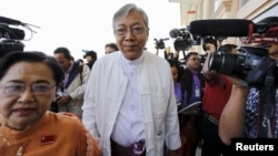 FILE - Htin Kyaw, nominated as Myanmar's National League for Democracy presidential candidate, arrives at Parliament in Naypyitaw, Feb. 1, 2016.
