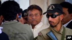 Pakistan's former president and military ruler Pervez Musharraf, center, leaves after appearing in court in Rawalpindi, Pakistan, April 17, 2013. 