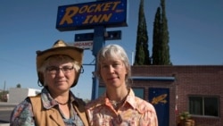 Val Wilkes, 54, (L) and her wife Cydney Wilkes, 56, stand outside their motel, the Rocket Inn, in Truth or Consequences, New Mexico May 2, 2014. (REUTERS/Lucy Nicholson)