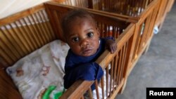 FILE - Imani, an abandoned child at Don Bosco Ngangi community center in Goma, North Kivu region, Democratic Republic of Congo, Aug. 6, 2013.