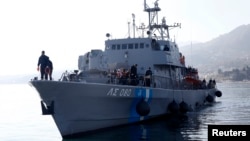 Greek Coast Guard vessel Agios Efstratios, carrying refugees and migrants following a rescue operation, approaches the port of the Greek island of Lesbos, Feb. 8, 2016. Picture taken Feb. 8, 2016. 