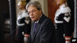 Premier-designate Paolo Gentiloni speaks at the Quirinale presidential palace, in Rome, Monday, Dec. 12, 2016. Gentiloni said he succeeded in forming a new government, ending a political crisis, after Matteo Renzi resigned on Dec. 7, so the country can quickly tackle pressing problems. 