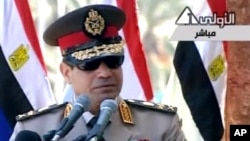 In this image taken from Egypt State TV, Egyptian army chief Abdel Fattah el-Sissi delivers a speech in Cairo, July 24, 2013. 