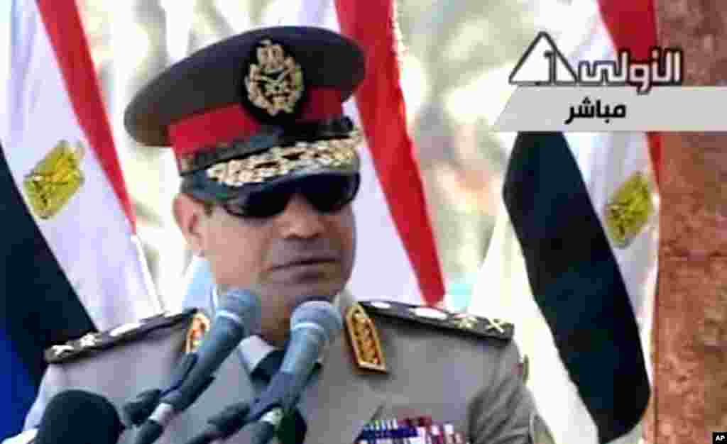 In this image taken from Egypt State TV, Egyptian army chief Abdel Fattah el-Sissi delivers a speech in Cairo, July 24, 2013. 