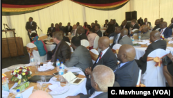 Zimbabwe business executives in Harare follow an address by President Emmerson Mnangagwa who wants to address the country’s melting economy, Oct. 29, 2018 
