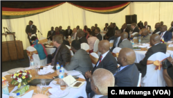 Zimbabwe business executives in Harare follow an address by President Emmerson Mnangagwa who wants to address the country’s melting economy, Oct. 29, 2018 