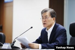 FILE - South Korean President Moon Jae-in speaks at Korea's National Security Council Meeting in response to North Korea's ICBM launch, July 2017.