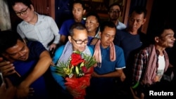 Members of the dissolved opposition Cambodia National Rescue Party (CNRP), pose for a picture after they were released from jail by King Norodom Sihamoni's pardon in Phnom Penh, Cambodia, Aug. 28, 2018.