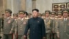 FILE - North Korean leader Kim Jong Un, with troops, visits the Kumsusan Palace on the anniversary of the armistice signing that ended the Korean War.