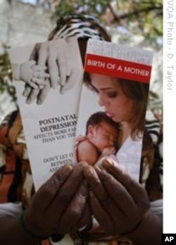 Soweto resident Noxolo Grootboom holds pamphlets highlighting the dangers of postnatal depression. There are few mental health facilities in Africa's impoverished areas, and some cultures don't recognize the existence of depression.