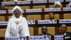 A Sudanese parliament member speaks during a National Assembly emergency session discussing a state of emergency declared by the president following anti-government protests, on March 11, 2019.