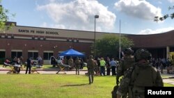 Law enforcement officers respond to a hooting attack at Santa Fe High School near Houston, Texas. (Photo released on May 18, 2018. Courtesy HCSO/Handout via REUTERS) 