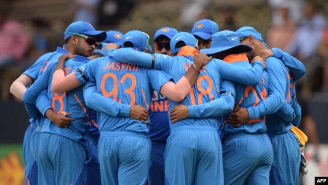 FILE - Indian team forms a huddle prior to the start of a cricket match between India and Australia at the M. Chinnaswamy Stadium in Bangalore on January 19, 2020. (Photo by Manjunath KIRAN / AFP)