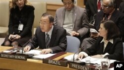 Brazilian Ambassador to the United Nations Maria Luiza Ribeiro Viotti, right, listens as United Nations Secretary-General Ban Ki-moon addresses the Security Council after its vote on peace and security in Africa, February 26, 2011, at UN headquarters