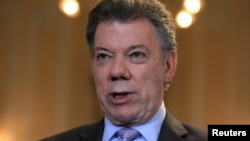 Colombia's President Juan Manuel Santos speaks during a Reuters interview at the presidential palace in Bogota, April 7, 2015. 