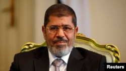 Egypt's President Mohamed Mursi at the presidential palace in Cairo, October 8, 2012 file photo. 