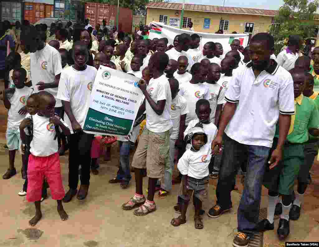 Children march at the Nyakuron Cultural Center in Juba to mark the Day of the African Child.