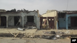 Des traces de l’attaque sur les maisons à Damaturu, Nigeria, 18 juin 2014.