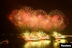 Fireworks light up the sky over Xiangzhou port of Zhuhai during a celebration to mark 40 years since Zhuhai became a city, in Guangdong province, China, March 5, 2019.