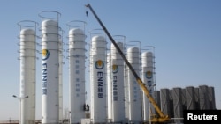 A liquefied natural gas storage facility of the ENN Group Co is under construction in Baoding, Hebei province, China, Dec. 5, 2017.