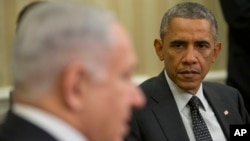 FILE - President Barack Obama listens as Israeli Prime Minister Benjamin Netanyahu speaks during their meeting in the Oval Office of the White House in Washington, Oct. 1, 2014.