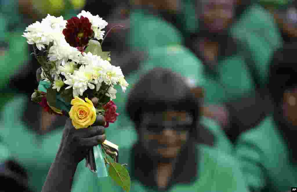 Members of the African National Congress Women's League gather outside the family home of the late Winnie Madikizela-Mandela, in Soweto, South Africa. South Africa declared 10 days of national mourning for Winnie Madikizela-Mandela, the anti-apartheid activist and ex-wife of Nelson Mandela, who died at age 81 after a long illness.