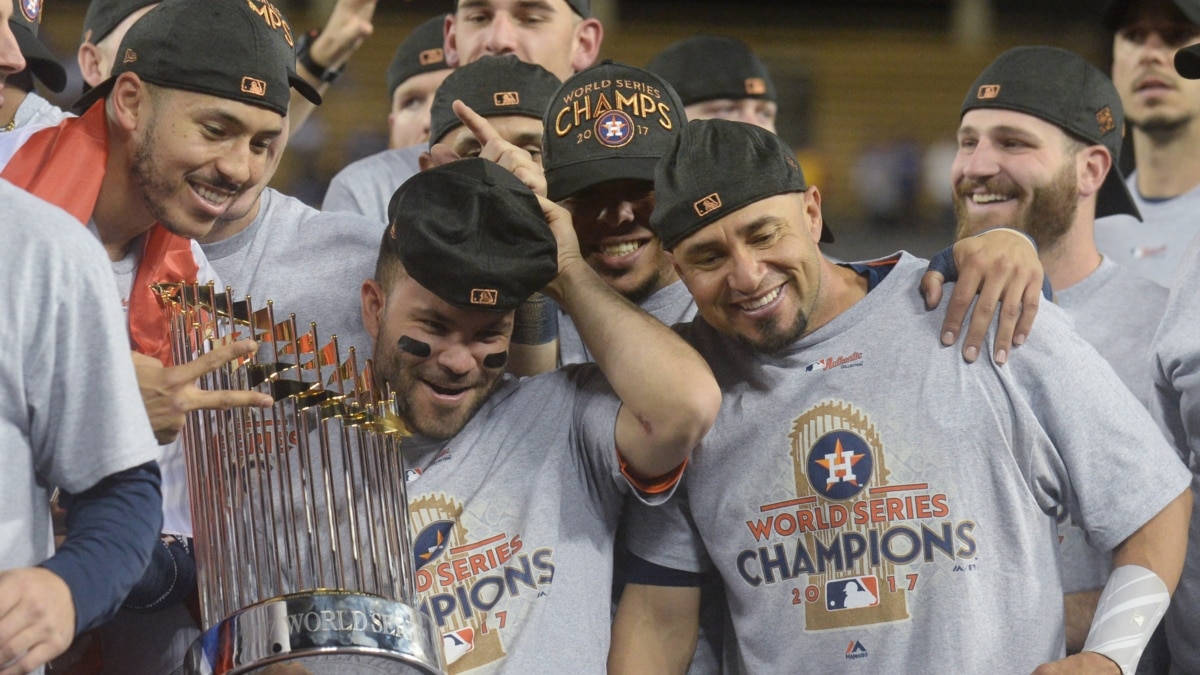 Houston Astros players celebrate with the Commissioners trophy after  beating the Los Angeles Dodgers in the 2017 MLB World Series game seven at  Dodger Stadium in Los Angeles on November 1, 2017.
